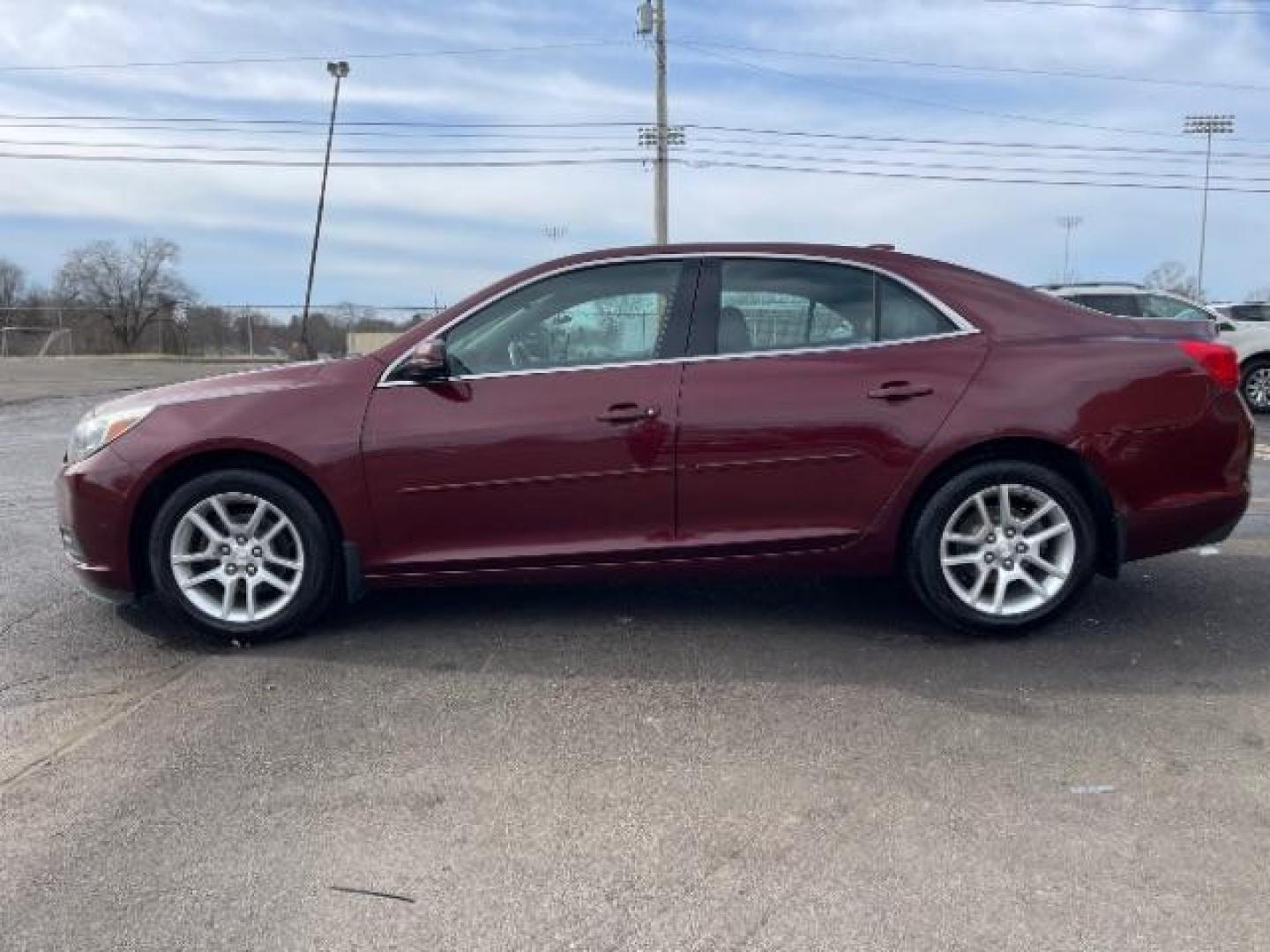 2015 Butte Red Metallic Chevrolet Malibu 1LT (1G11C5SL6FF) with an 2.5L L4 DOHC 16V engine, 6-Speed Automatic transmission, located at 1230 East Main St, Xenia, OH, 45385, (937) 908-9800, 39.688026, -83.910172 - Photo#2