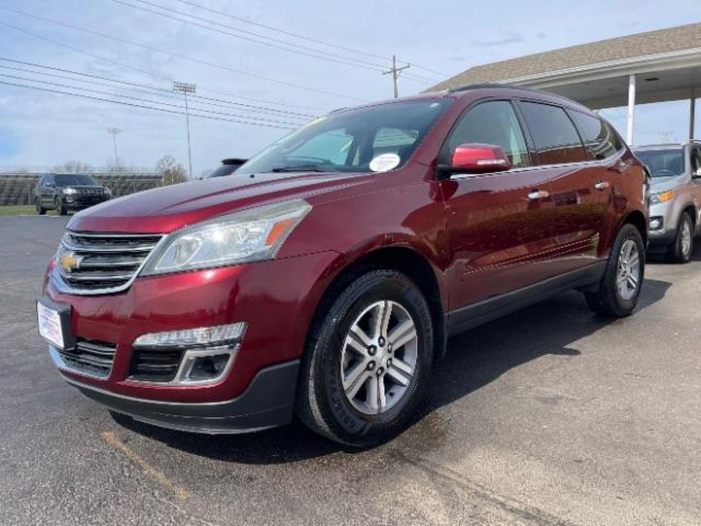 2015 Siren Red Tintcoat Chevrolet Traverse 2LT AWD (1GNKVHKD7FJ) with an 3.6L V6 DOHC 24V engine, 6-Speed Automatic transmission, located at 1099 N County Rd 25A , Troy, OH, 45373, (937) 908-9800, 40.057079, -84.212883 - Photo#1