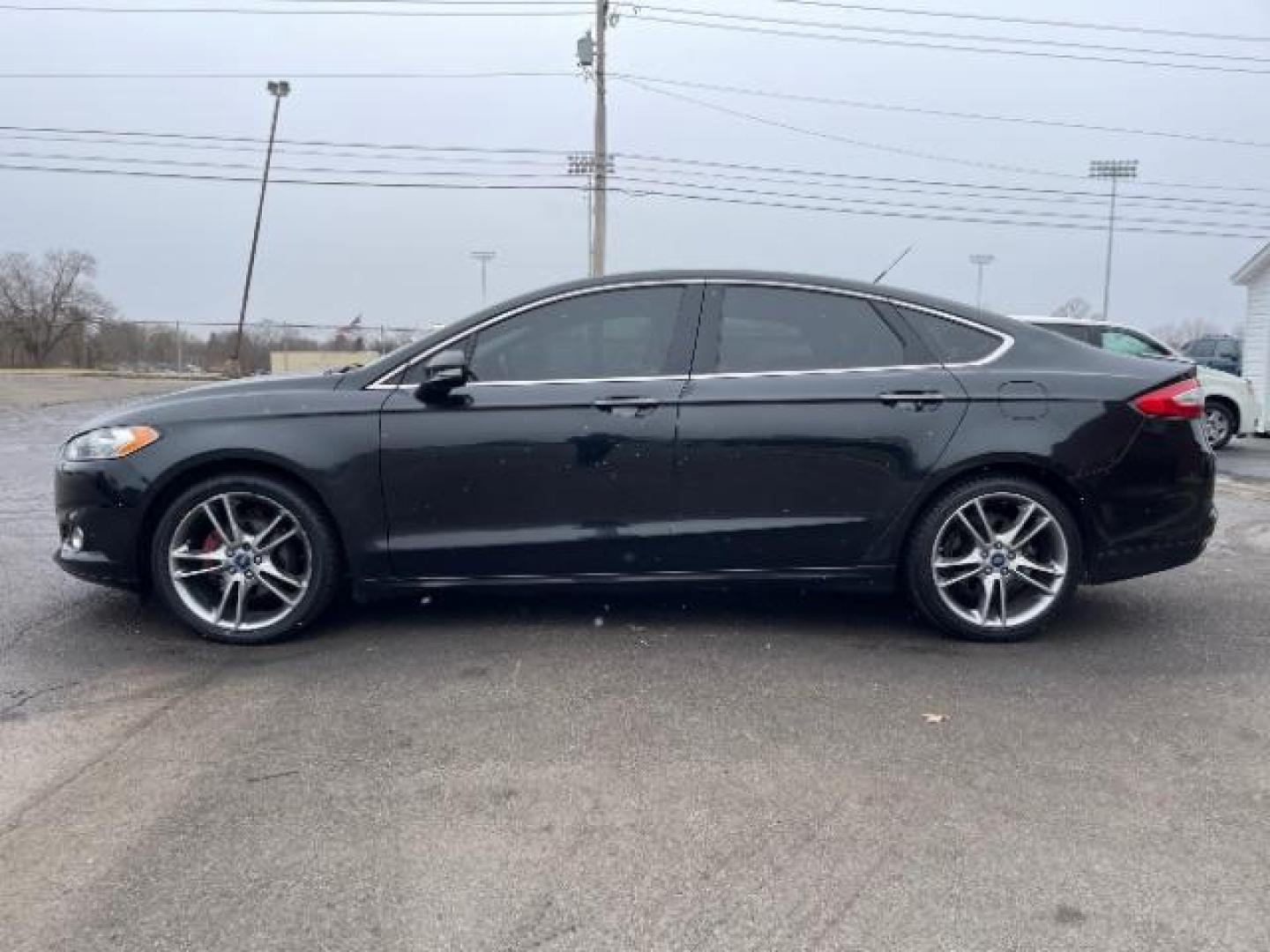 2015 Tuxedo Black Ford Fusion Titanium (3FA6P0K99FR) with an 2.0L L4 DOHC 16V engine, 6-Speed Automatic transmission, located at 401 Woodman Dr, Riverside, OH, 45431, (937) 908-9800, 39.760899, -84.123421 - Photo#2