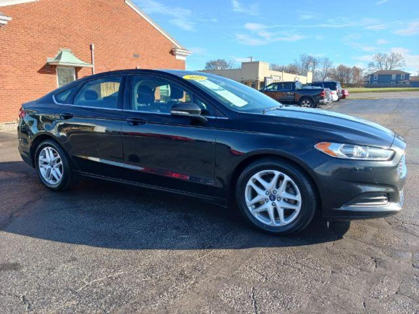 2015 Tuxedo Black Ford Fusion SE (3FA6P0H7XFR) with an 2.5L L4 DOHC 16V engine, 6-Speed Automatic transmission, located at 1230 East Main St, Xenia, OH, 45385, (937) 908-9800, 39.688026, -83.910172 - Photo#0