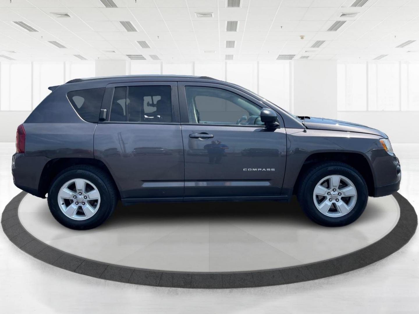 2015 Granite Crystal Metallic Clear Coat Jeep Compass Sport FWD (1C4NJCBA1FD) with an 2.0L L4 DOHC 16V engine, located at 1951 S Dayton Lakeview Rd., New Carlisle, OH, 45344, (937) 908-9800, 39.890999, -84.050255 - 2015 Jeep Compass Sport FWD - Photo#1