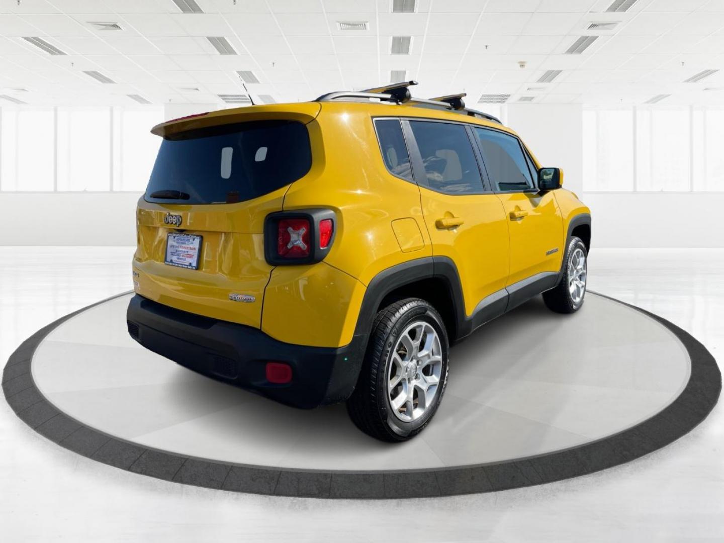 2015 Solar Yellow Jeep Renegade Latitude 4WD (ZACCJBBT3FP) with an 2.4L L4 engine, 6-Speed Manual transmission, located at 1184 Kauffman Ave, Fairborn, OH, 45324, (937) 908-9800, 39.807072, -84.030914 - Photo#2