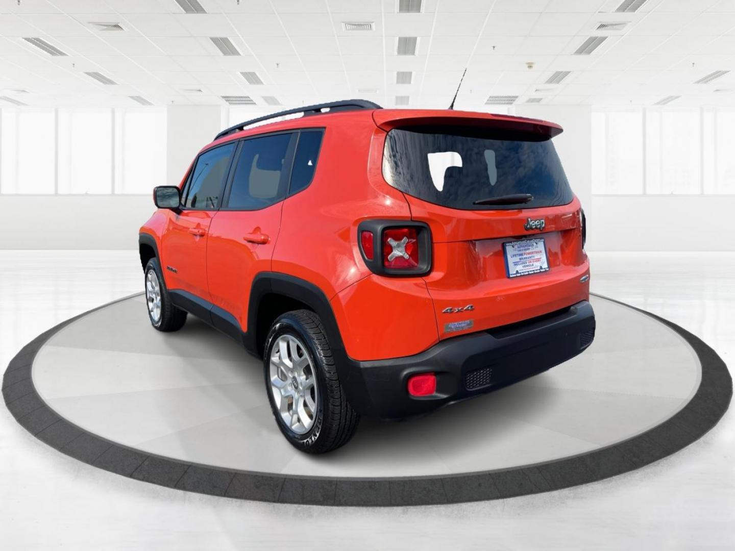 2015 Omaha Orange Jeep Renegade Latitude 4WD (ZACCJBBT2FP) with an 2.4L L4 engine, 6-Speed Manual transmission, located at 1951 S Dayton Lakeview Rd., New Carlisle, OH, 45344, (937) 908-9800, 39.890999, -84.050255 - Photo#4