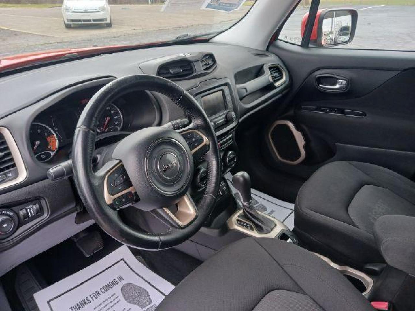 2015 Omaha Orange Jeep Renegade Latitude 4WD (ZACCJBBT1FP) with an 2.4L L4 DOHC 16V engine, 6-Speed Manual transmission, located at 401 Woodman Dr, Riverside, OH, 45431, (937) 908-9800, 39.760899, -84.123421 - Photo#6