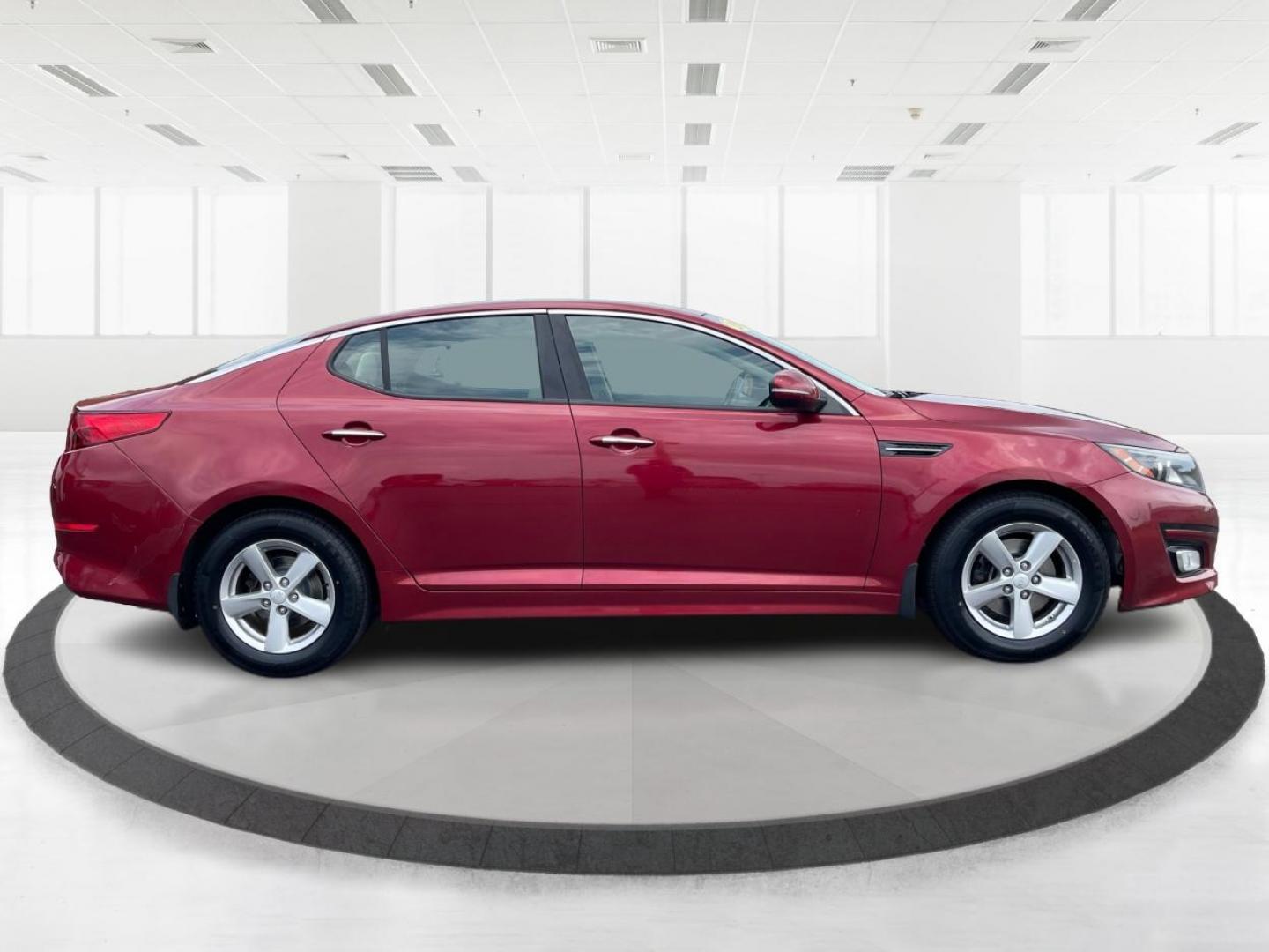 2015 Remington Red Metallic Kia Optima LX (5XXGM4A79FG) with an 2.4L L4 DOHC 16V engine, 6-Speed Automatic transmission, located at 4508 South Dixie Dr, Moraine, OH, 45439, (937) 908-9800, 39.689976, -84.218452 - Photo#1