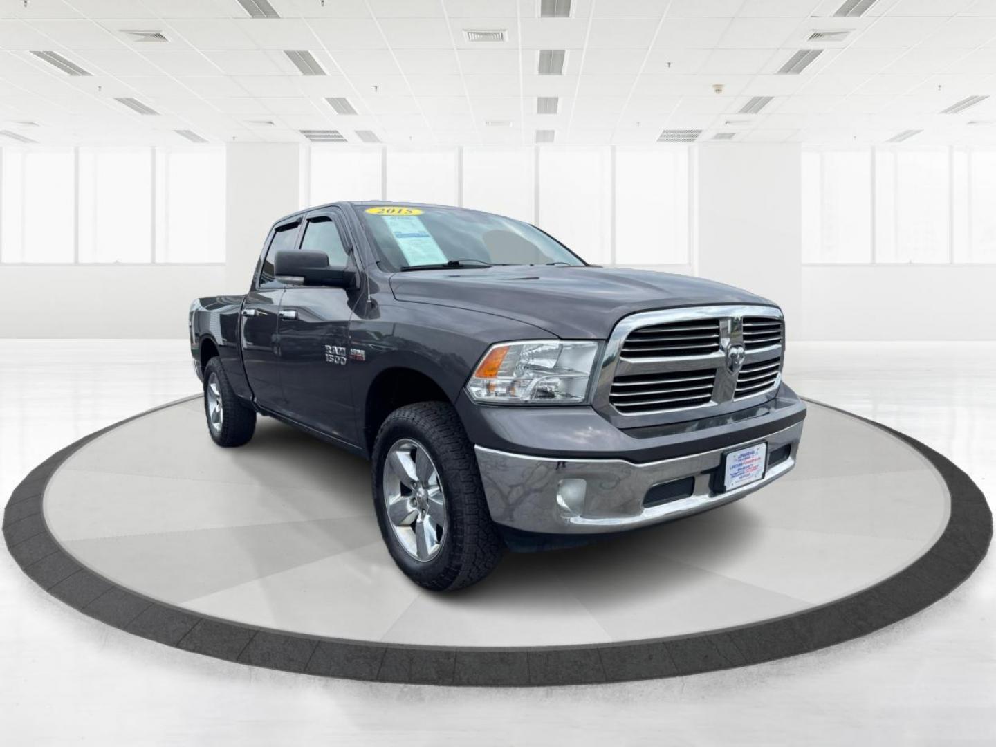 2015 Gray RAM 1500 SLT Quad Cab 4WD (1C6RR7GT3FS) with an 5.7L V8 OHV 16V engine, 8-Speed Automatic transmission, located at 1951 S Dayton Lakeview Rd., New Carlisle, OH, 45344, (937) 908-9800, 39.890999, -84.050255 - Photo#0