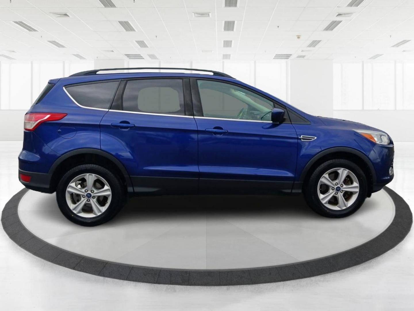 2016 Deep Impact Blue Metallic Ford Escape SE 4WD (1FMCU9G9XGU) with an 2.0L L4 DOHC 16V engine, 6-Speed Automatic transmission, located at 4508 South Dixie Dr, Moraine, OH, 45439, (937) 908-9800, 39.689976, -84.218452 - Photo#1