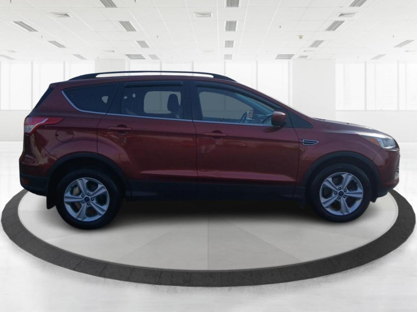 2016 Sunset Metallic Ford Escape SE 4WD (1FMCU9G95GU) with an 2.0L L4 DOHC 16V engine, 6-Speed Automatic transmission, located at 4508 South Dixie Dr, Moraine, OH, 45439, (937) 908-9800, 39.689976, -84.218452 - Photo#1