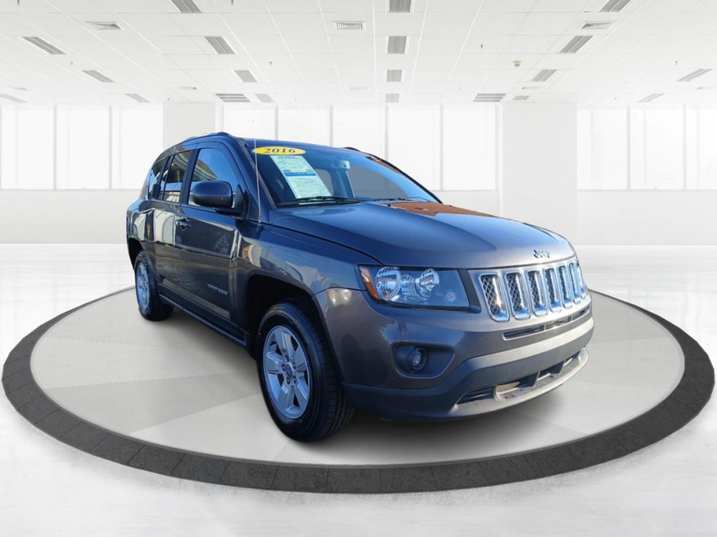 2016 Gray Jeep Compass Latitude FWD (1C4NJCEB4GD) with an 2.4L L4 DOHC 16V engine, CVT transmission, located at 880 E. National Road, Vandalia, OH, 45377, (937) 908-9800, 39.891918, -84.183594 - Photo#0