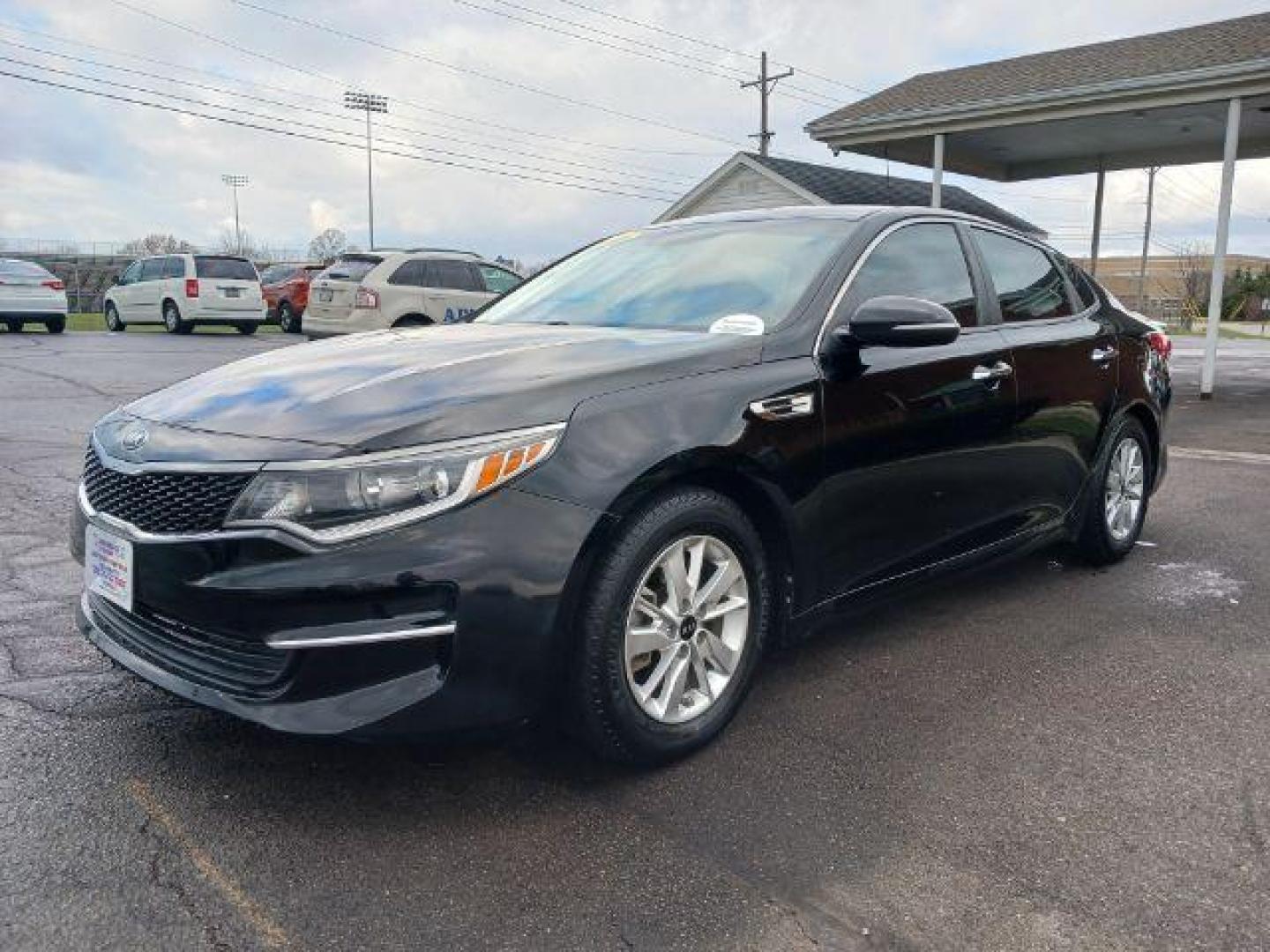 2016 Ebony Black Kia Optima LX (5XXGT4L39GG) with an 2.4L L4 DOHC 16V engine, 6-Speed Automatic transmission, located at 1230 East Main St, Xenia, OH, 45385, (937) 908-9800, 39.688026, -83.910172 - Photo#2