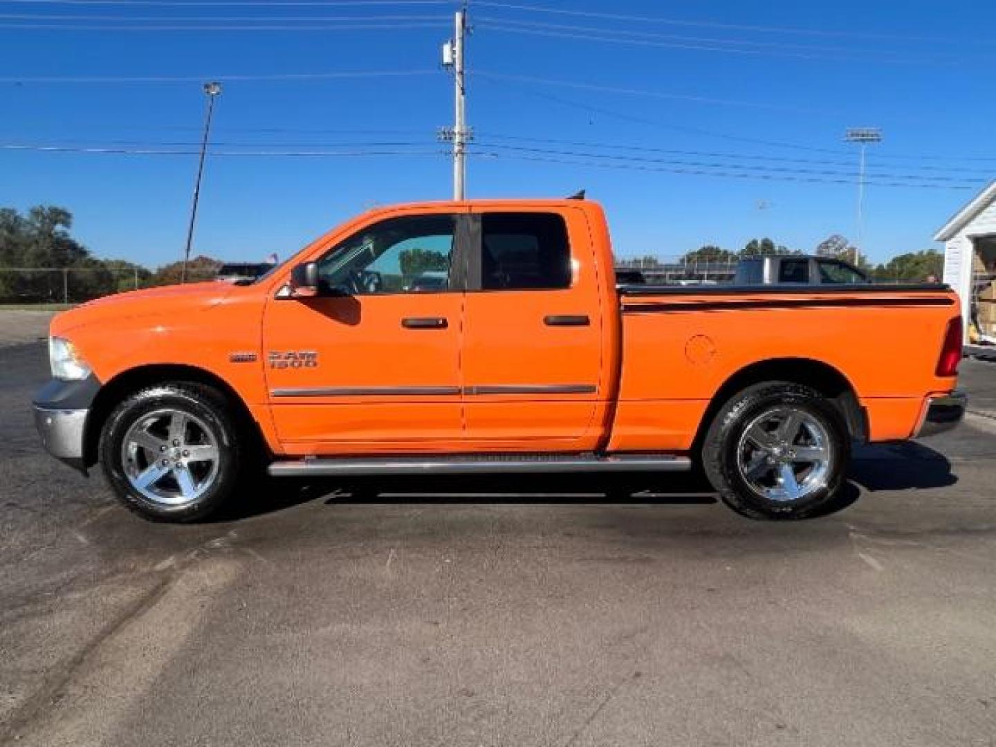 2016 Low Vol Omaha Orange RAM 1500 SLT Quad Cab 4WD (1C6RR7GT3GS) with an 5.7L V8 OHV 16V engine, 8-Speed Automatic transmission, located at 1099 N County Rd 25A , Troy, OH, 45373, (937) 908-9800, 40.057079, -84.212883 - Photo#3