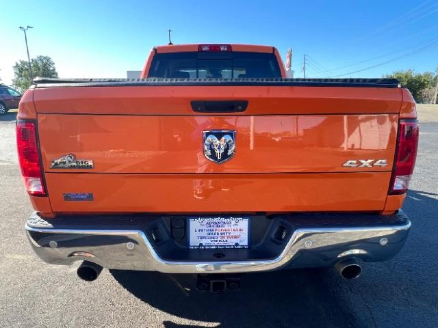 2016 Low Vol Omaha Orange RAM 1500 SLT Quad Cab 4WD (1C6RR7GT3GS) with an 5.7L V8 OHV 16V engine, 8-Speed Automatic transmission, located at 1099 N County Rd 25A , Troy, OH, 45373, (937) 908-9800, 40.057079, -84.212883 - Photo#4