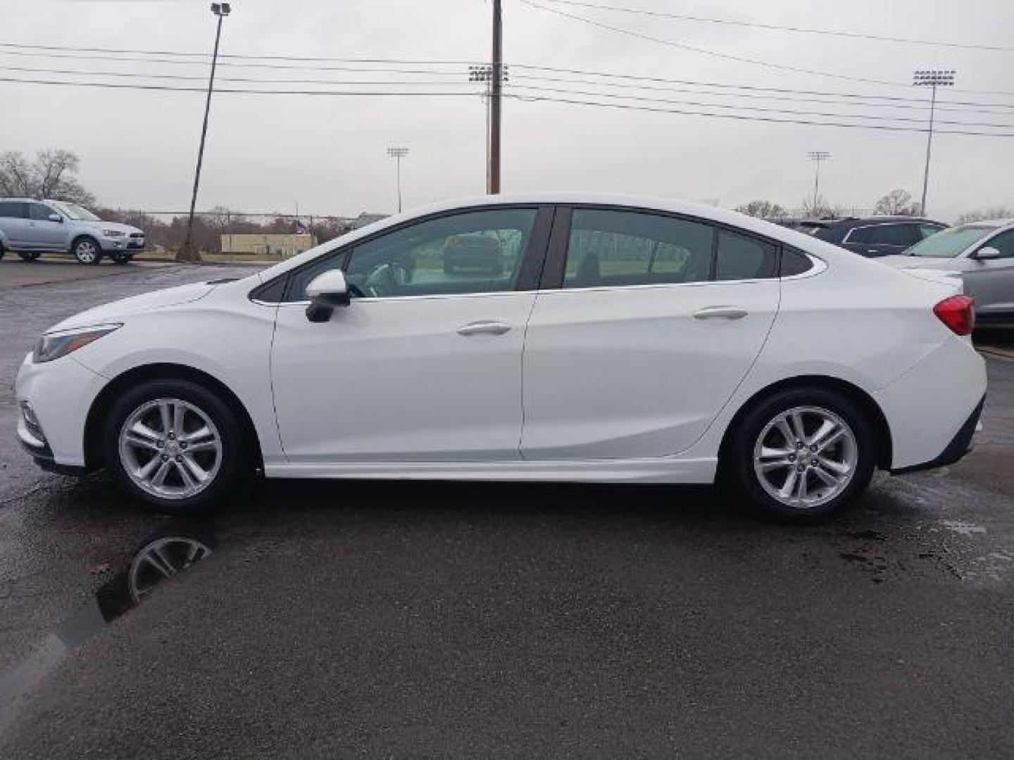 2017 Summit White Chevrolet Cruze LT Auto (1G1BE5SM9H7) with an 1.4L L4 DOHC 16V TURBO engine, 6-Speed Automatic transmission, located at 1951 S Dayton Lakeview Rd., New Carlisle, OH, 45344, (937) 908-9800, 39.890999, -84.050255 - Photo#3