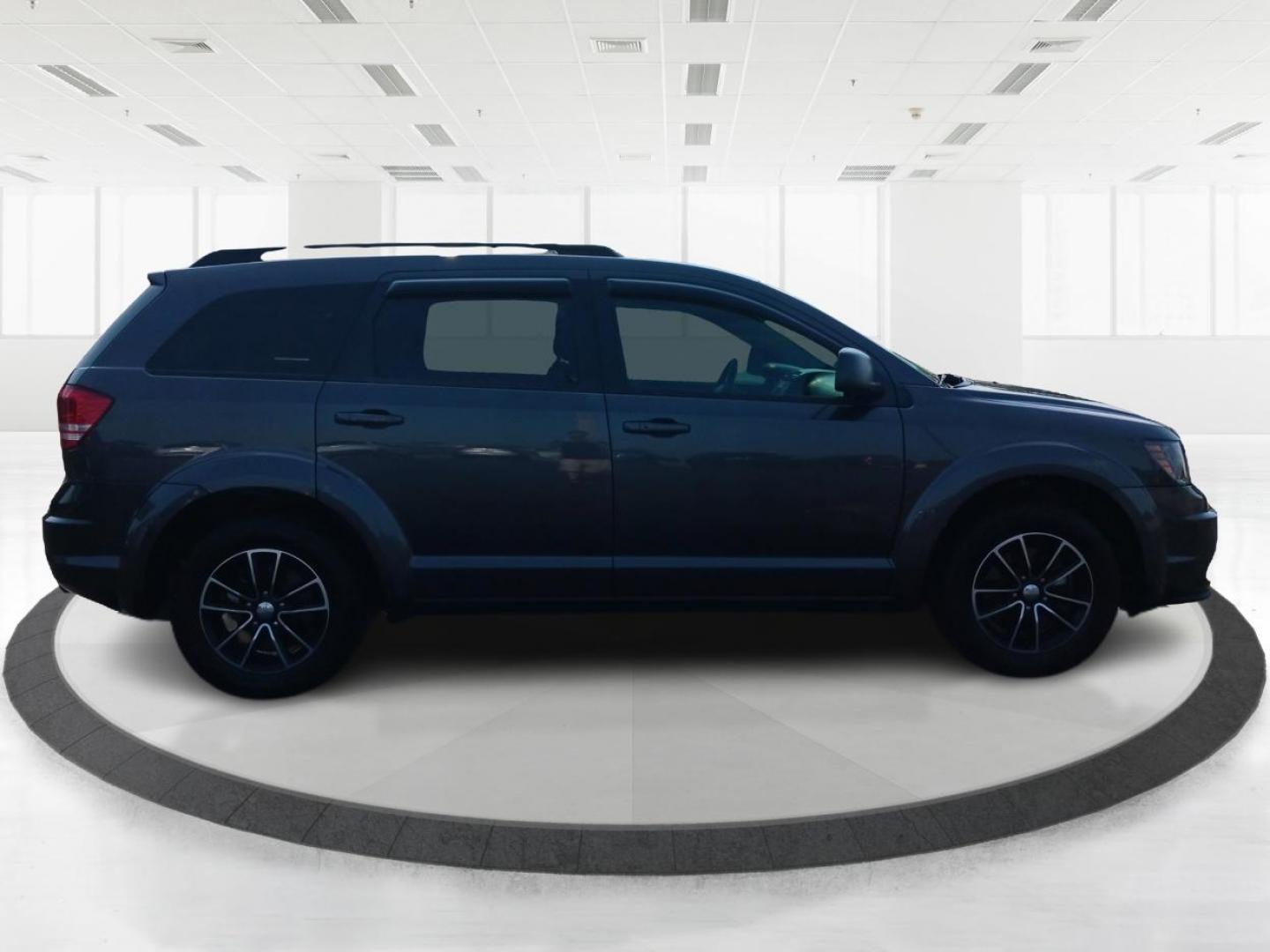 2017 Granite Metallic Clear Coat Dodge Journey SE (3C4PDCAB5HT) with an 2.4L L4 DOHC 16V engine, 4A transmission, located at 1184 Kauffman Ave, Fairborn, OH, 45324, (937) 908-9800, 39.807072, -84.030914 - Photo#0