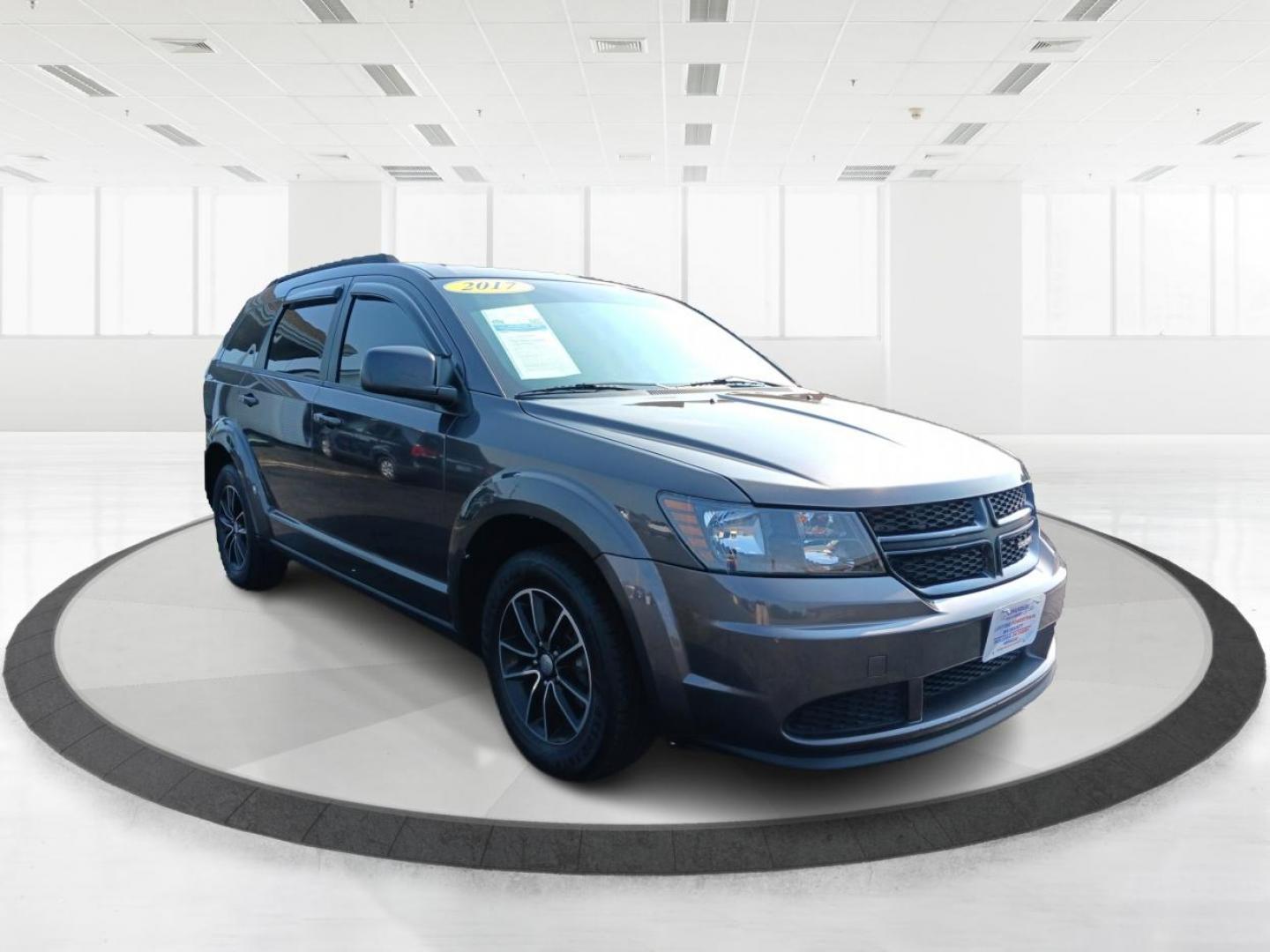 2017 Granite Metallic Clear Coat Dodge Journey SE (3C4PDCAB5HT) with an 2.4L L4 DOHC 16V engine, 4A transmission, located at 1184 Kauffman Ave, Fairborn, OH, 45324, (937) 908-9800, 39.807072, -84.030914 - Photo#5