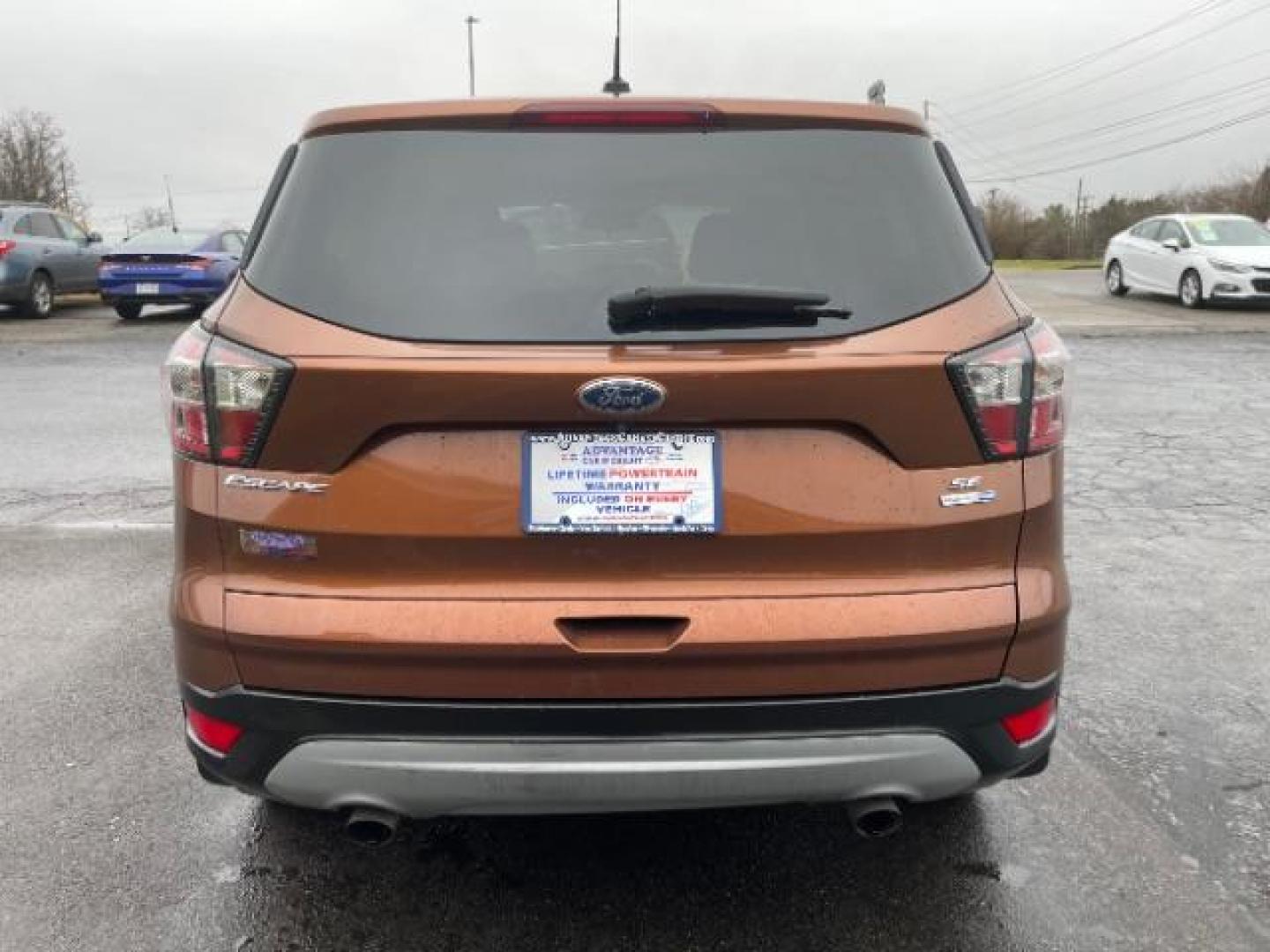 2017 Canyon Ridge Metallic Ford Escape SE 4WD (1FMCU9GDXHU) with an 1.5L L4 DOHC 16V engine, 6-Speed Automatic transmission, located at 1184 Kauffman Ave, Fairborn, OH, 45324, (937) 908-9800, 39.807072, -84.030914 - Photo#4