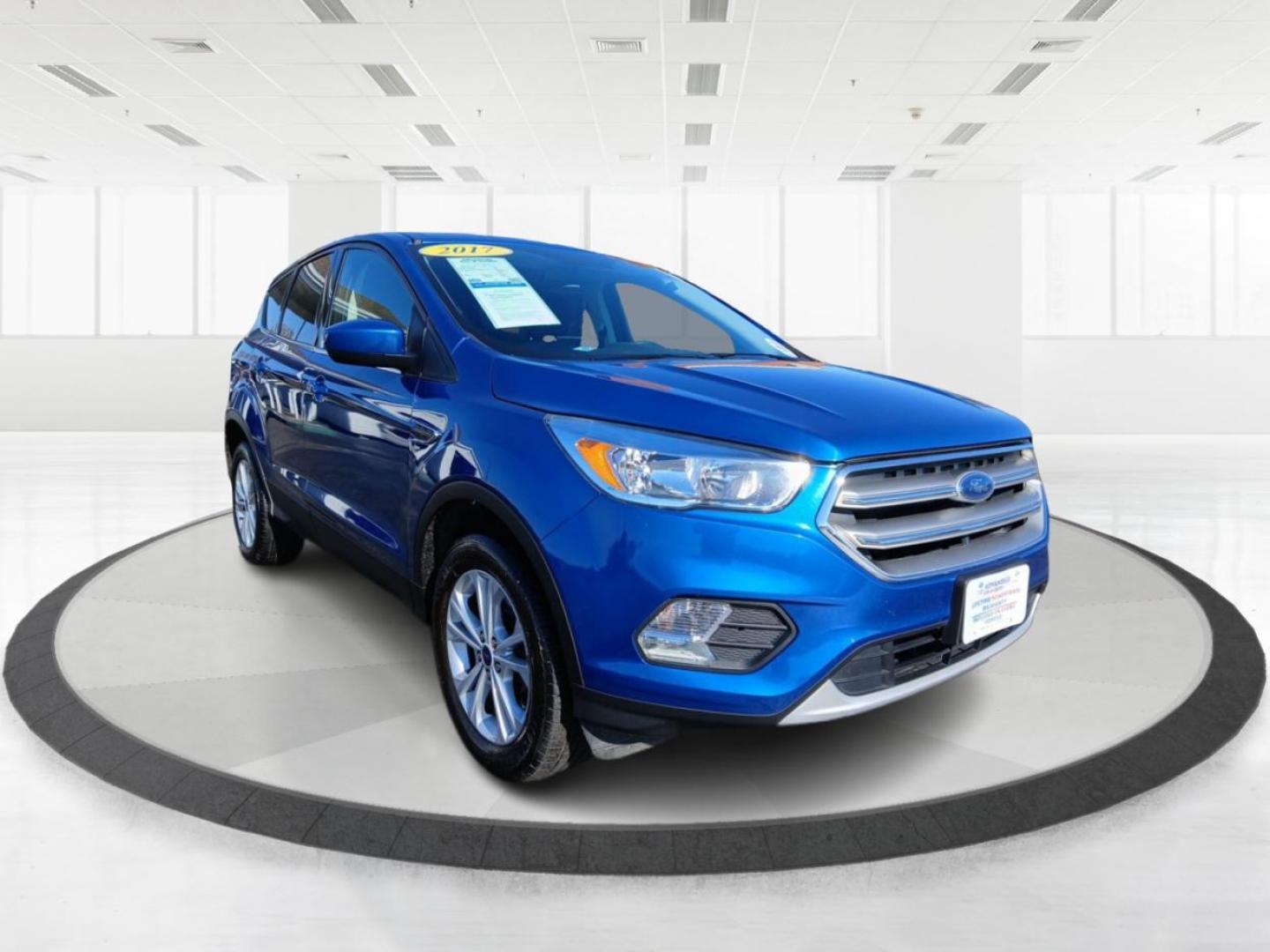 2017 Lightning Blue Metallic Ford Escape SE 4WD (1FMCU9G93HU) with an 2.0L L4 DOHC 16V engine, 6A transmission, located at 1099 N County Rd 25A , Troy, OH, 45373, (937) 908-9800, 40.057079, -84.212883 - Photo#0