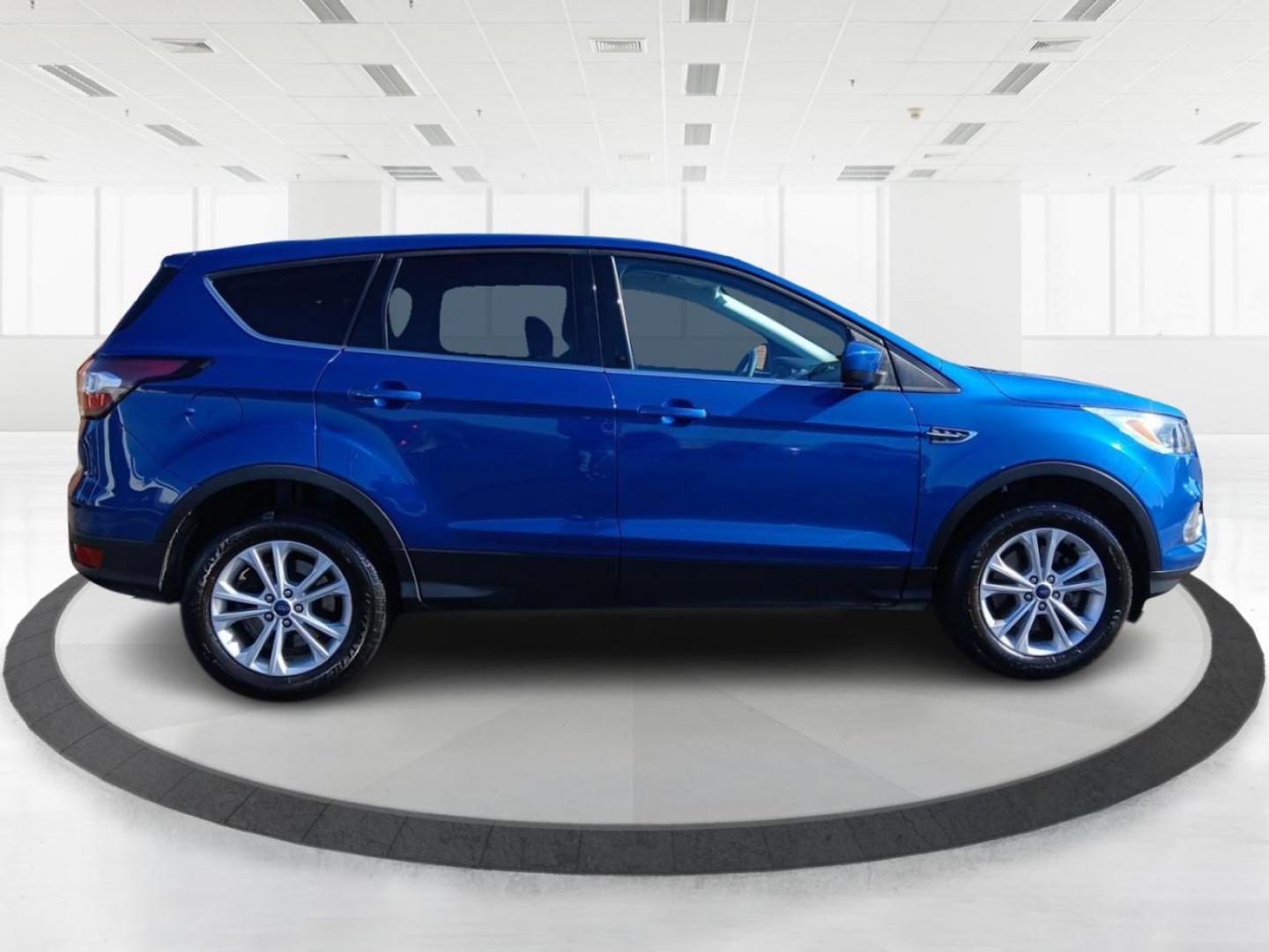 2017 Lightning Blue Metallic Ford Escape SE 4WD (1FMCU9G93HU) with an 2.0L L4 DOHC 16V engine, 6A transmission, located at 1099 N County Rd 25A , Troy, OH, 45373, (937) 908-9800, 40.057079, -84.212883 - Photo#1