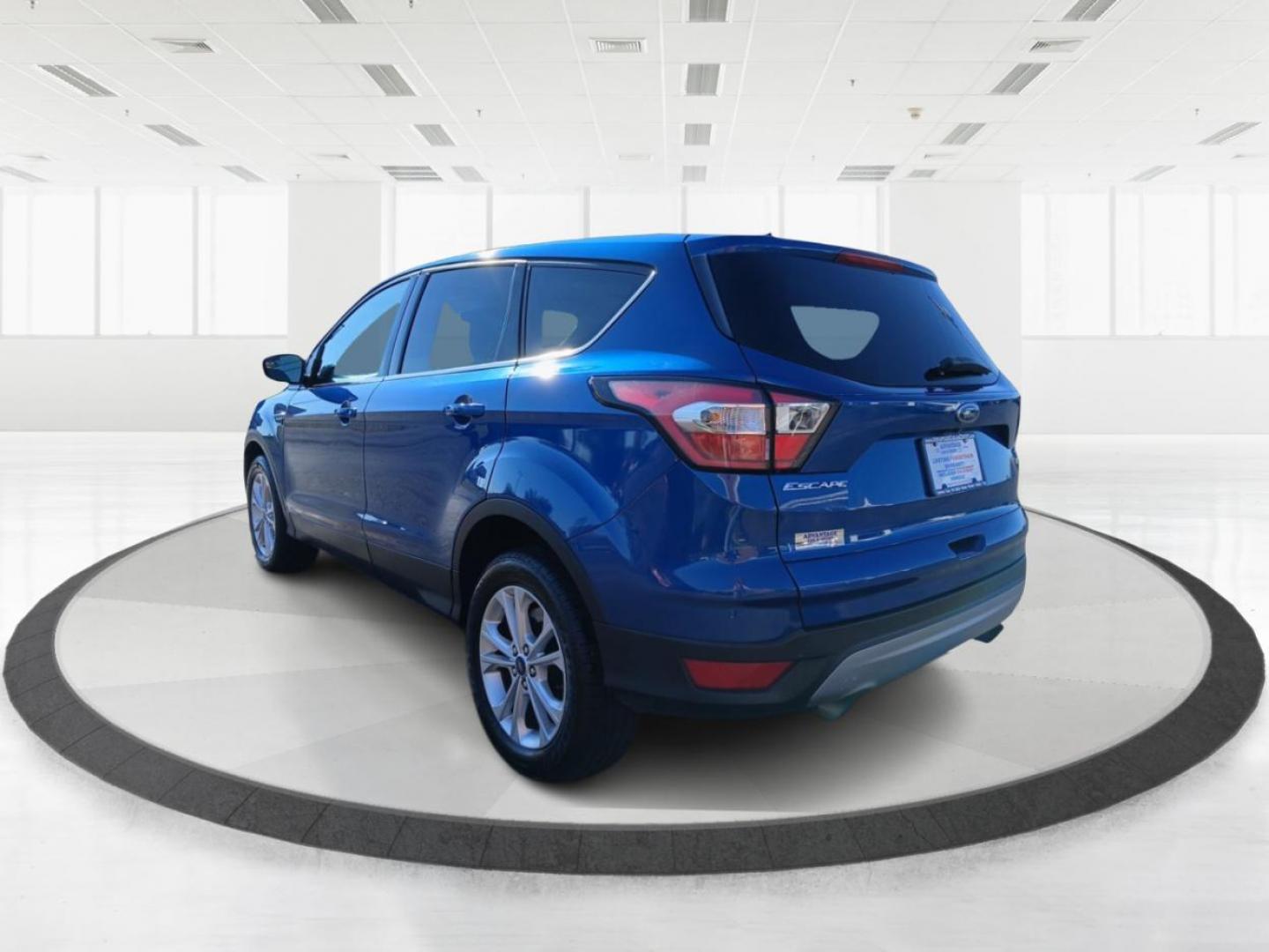 2017 Lightning Blue Metallic Ford Escape SE 4WD (1FMCU9G93HU) with an 2.0L L4 DOHC 16V engine, 6A transmission, located at 1099 N County Rd 25A , Troy, OH, 45373, (937) 908-9800, 40.057079, -84.212883 - Photo#4