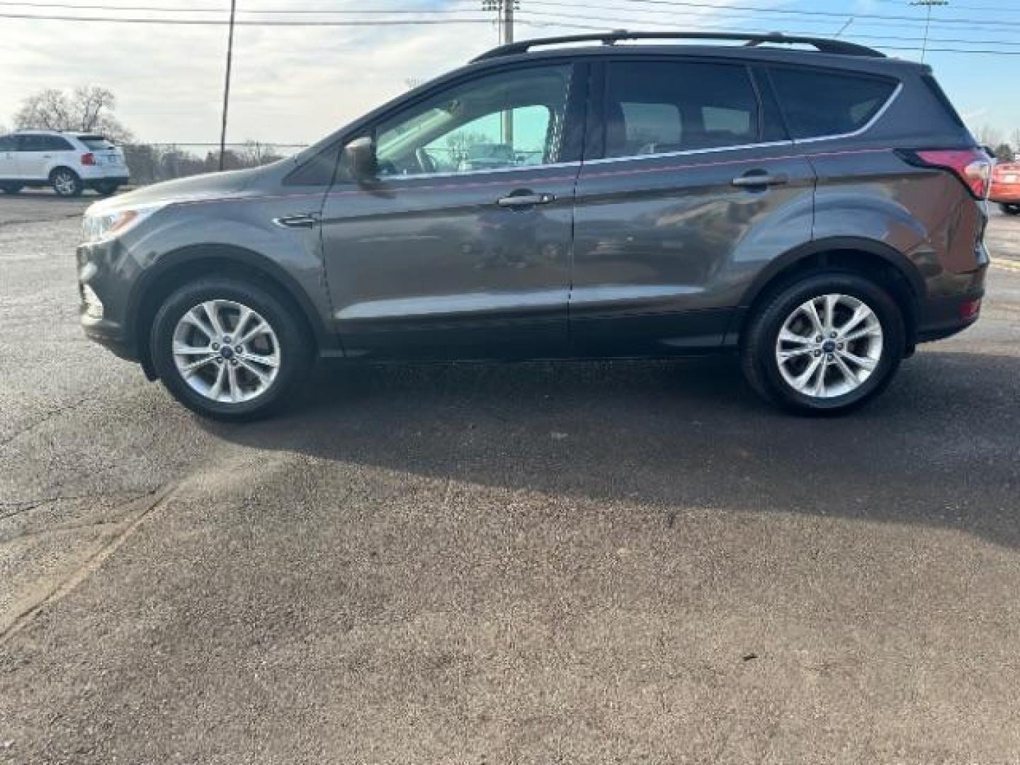 2017 Magnetic Metallic Ford Escape SE 4WD (1FMCU9G91HU) with an 2.0L L4 DOHC 16V engine, 6-Speed Automatic transmission, located at 1951 S Dayton Lakeview Rd., New Carlisle, OH, 45344, (937) 908-9800, 39.890999, -84.050255 - Photo#3