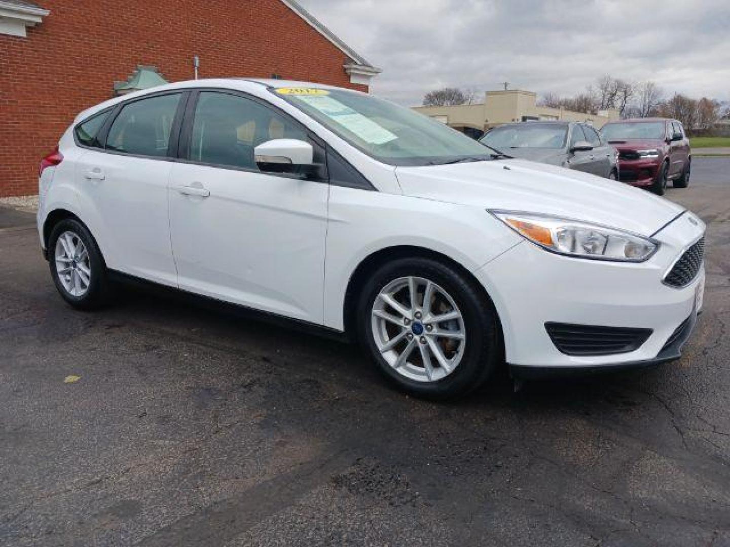 2017 Oxford White Ford Focus SE Hatch (1FADP3K23HL) with an 2.0L L4 DOHC 16V engine, located at 4508 South Dixie Dr, Moraine, OH, 45439, (937) 908-9800, 39.689976, -84.218452 - Photo#0