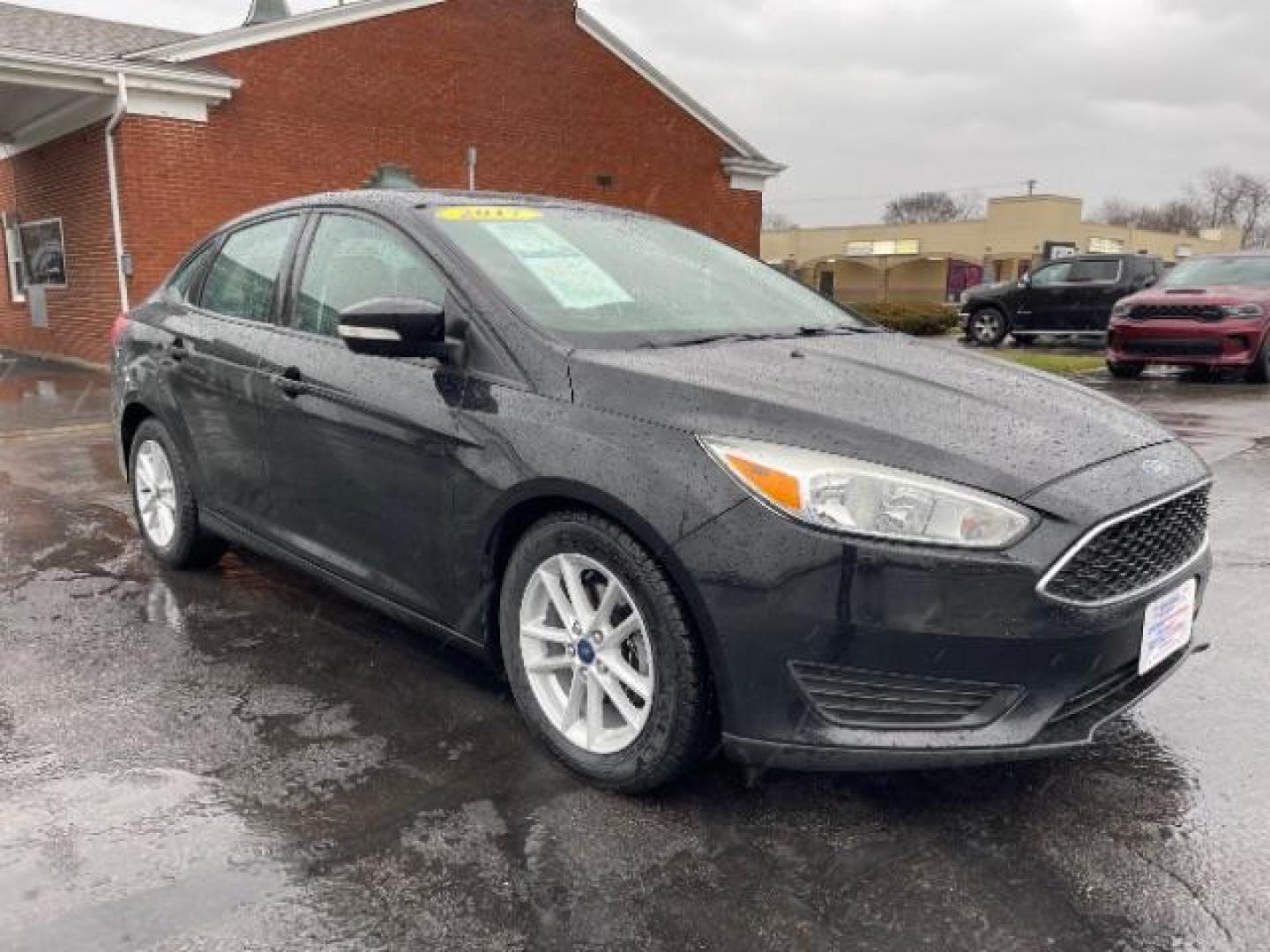 2017 Shadow Black Ford Focus SE Sedan (1FADP3F23HL) with an 2.0L L4 DOHC 16V engine, located at 1099 N County Rd 25A , Troy, OH, 45373, (937) 908-9800, 40.057079, -84.212883 - Photo#0