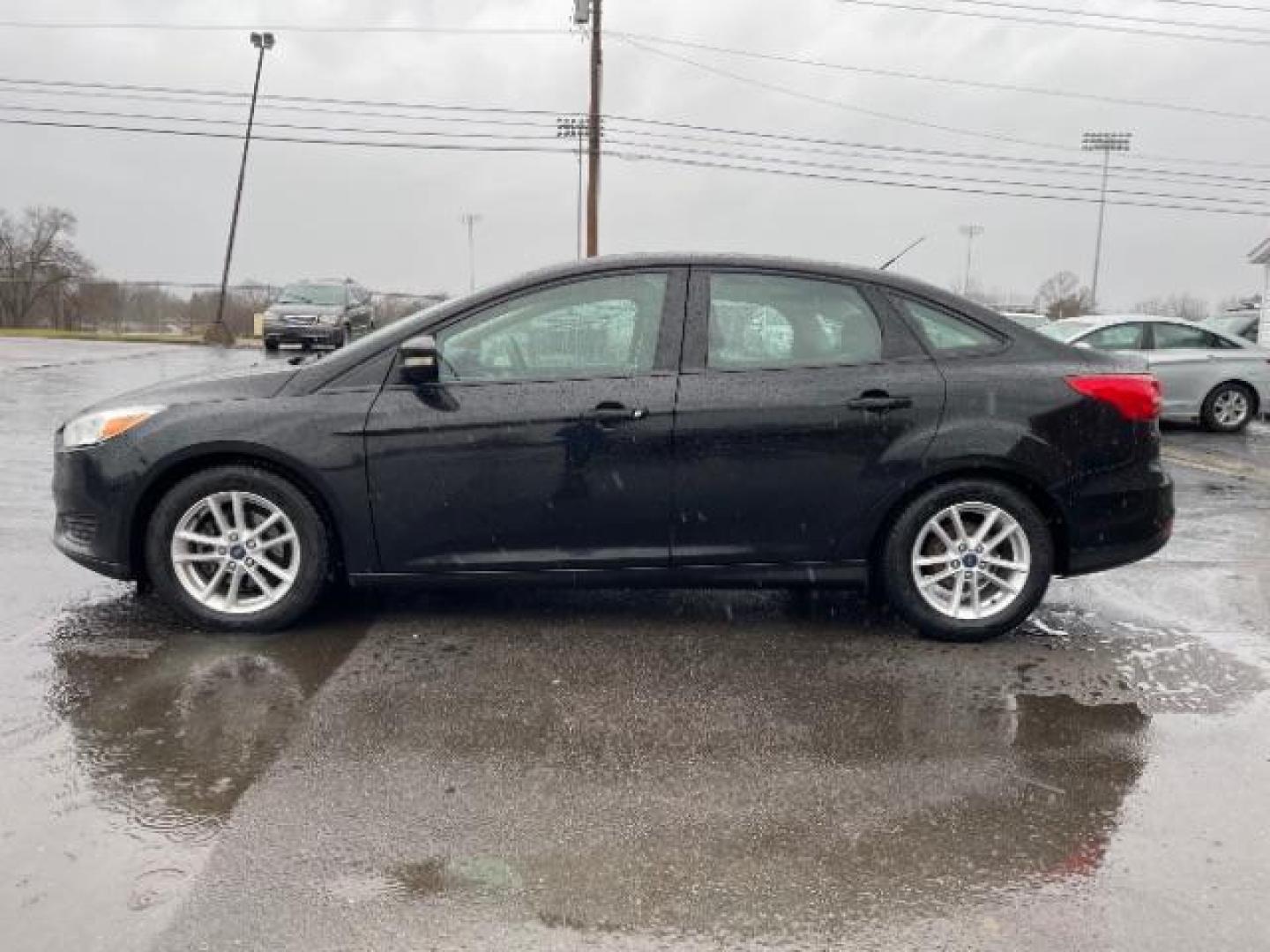 2017 Shadow Black Ford Focus SE Sedan (1FADP3F23HL) with an 2.0L L4 DOHC 16V engine, located at 1099 N County Rd 25A , Troy, OH, 45373, (937) 908-9800, 40.057079, -84.212883 - Photo#4