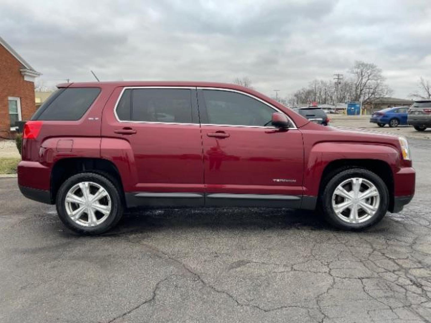 2017 Crimson Red Tintcoat GMC Terrain SLE2 AWD (2GKFLSEKXH6) with an 2.4L L4 DOHC 16V engine, 6-Speed Automatic transmission, located at 1099 N County Rd 25A , Troy, OH, 45373, (937) 908-9800, 40.057079, -84.212883 - Photo#1