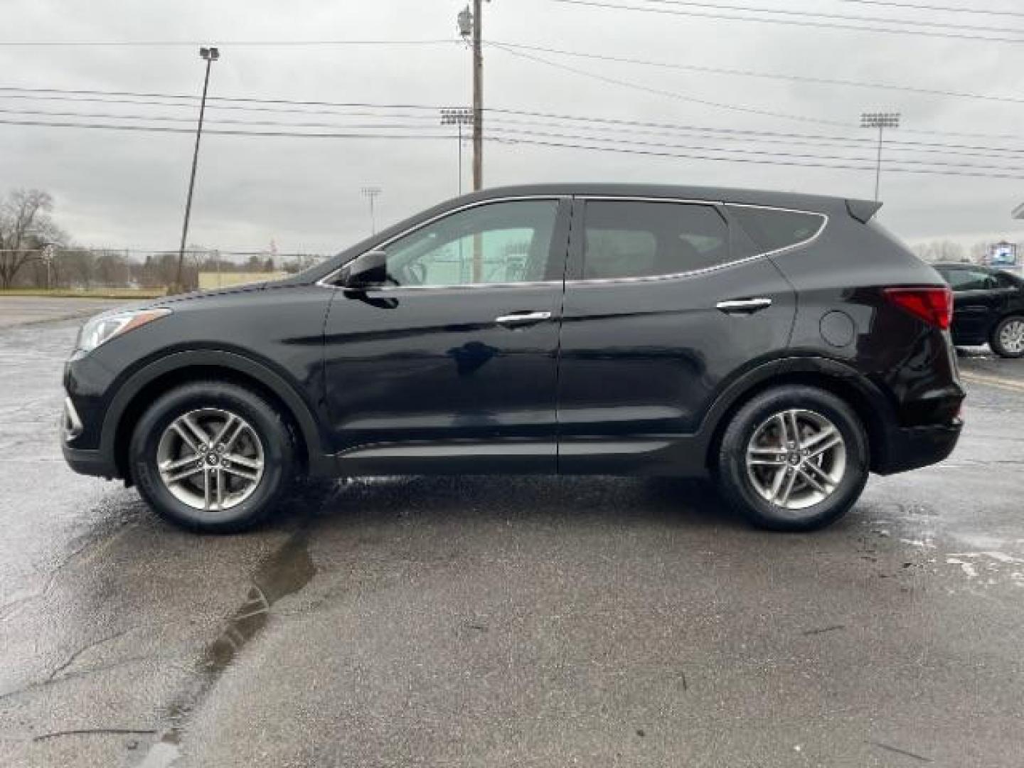 2017 Twilight Black Hyundai Santa Fe Sport 2.4 FWD (5XYZT3LBXHG) with an 2.4L L4 DOHC 16V engine, 6-Speed Automatic transmission, located at 1230 East Main St, Xenia, OH, 45385, (937) 908-9800, 39.688026, -83.910172 - Photo#2