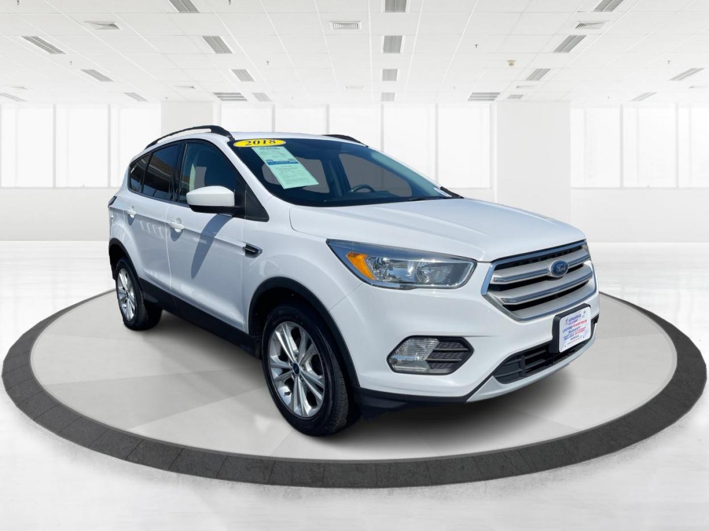 2018 Oxford White Ford Escape SE FWD (1FMCU0GD6JU) with an 1.5L L4 DOHC 16V engine, 6A transmission, located at 880 E. National Road, Vandalia, OH, 45377, (937) 908-9800, 39.891918, -84.183594 - Photo#0