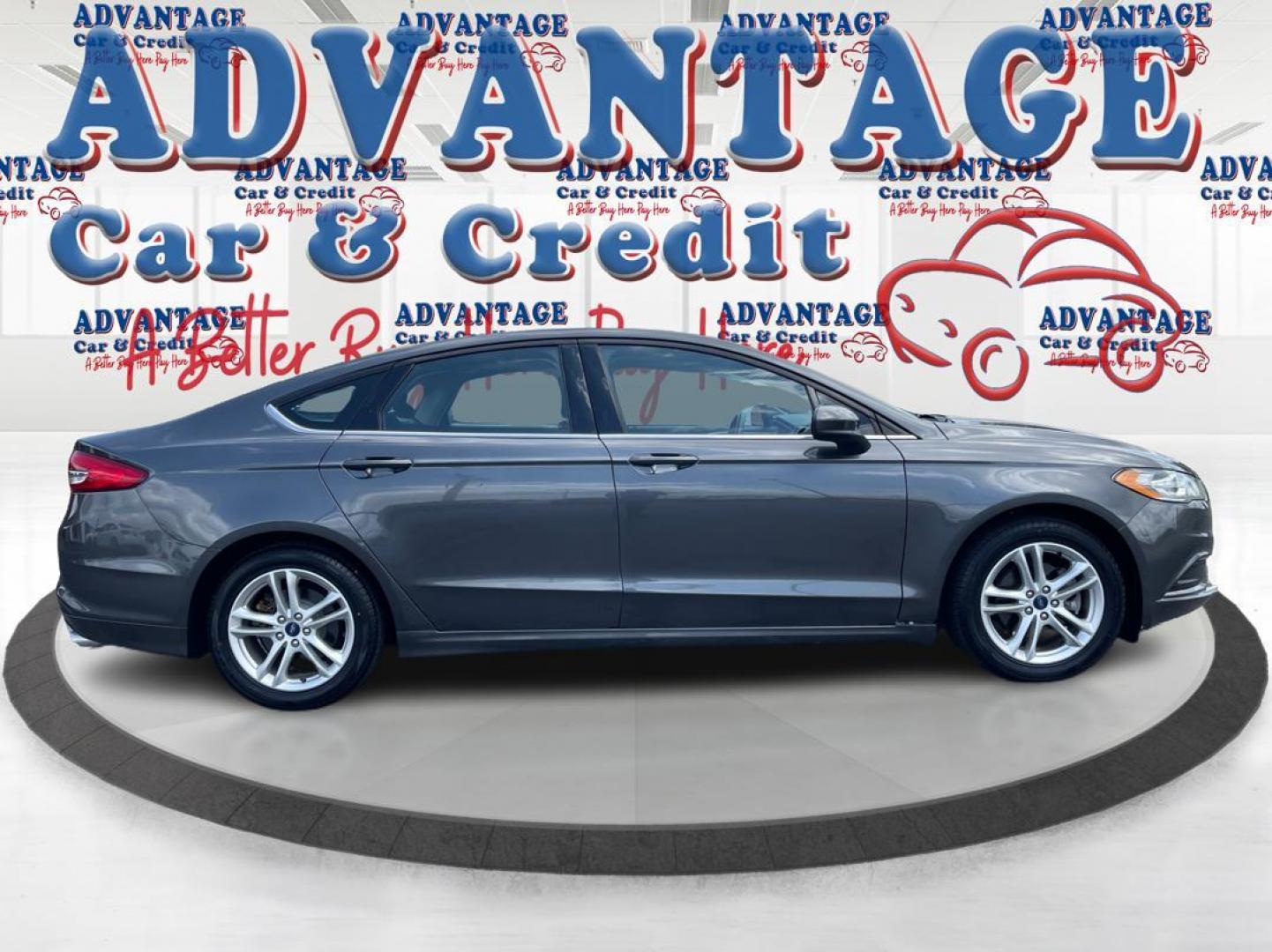 2018 Magnetic Metallic Ford Fusion SE (3FA6P0HD2JR) with an 1.5L L4 DOHC 16V engine, 6A transmission, located at 1184 Kauffman Ave, Fairborn, OH, 45324, (937) 908-9800, 39.807072, -84.030914 - Photo#1