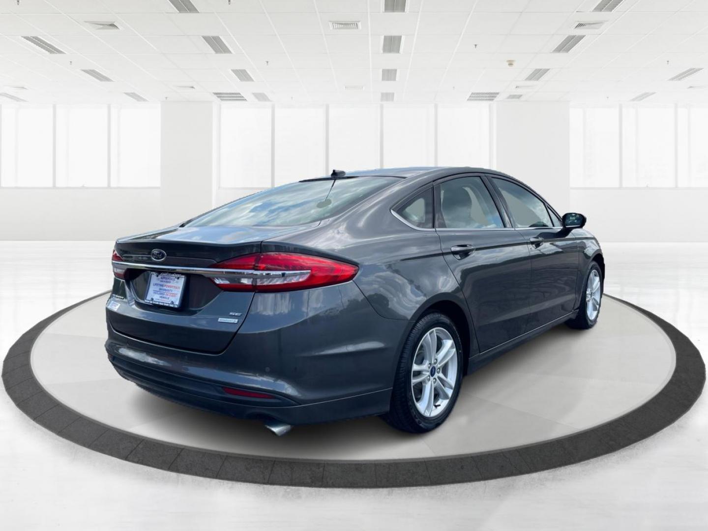 2018 Magnetic Metallic Ford Fusion SE (3FA6P0HD2JR) with an 1.5L L4 DOHC 16V engine, 6-Speed Automatic transmission, located at 1099 N County Rd 25A , Troy, OH, 45373, (937) 908-9800, 40.057079, -84.212883 - Photo#2