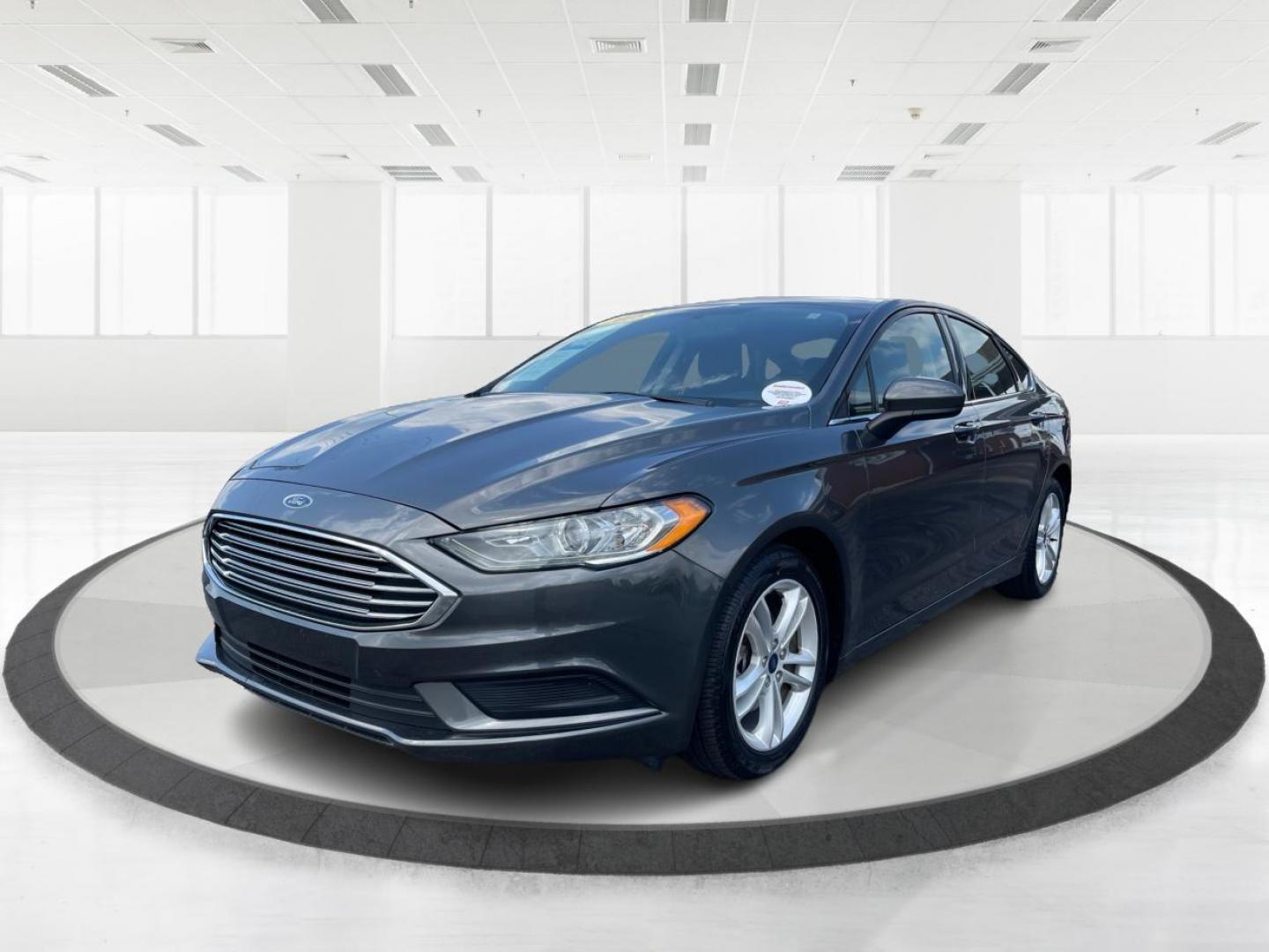 2018 Magnetic Metallic Ford Fusion SE (3FA6P0HD2JR) with an 1.5L L4 DOHC 16V engine, 6-Speed Automatic transmission, located at 1099 N County Rd 25A , Troy, OH, 45373, (937) 908-9800, 40.057079, -84.212883 - Photo#7