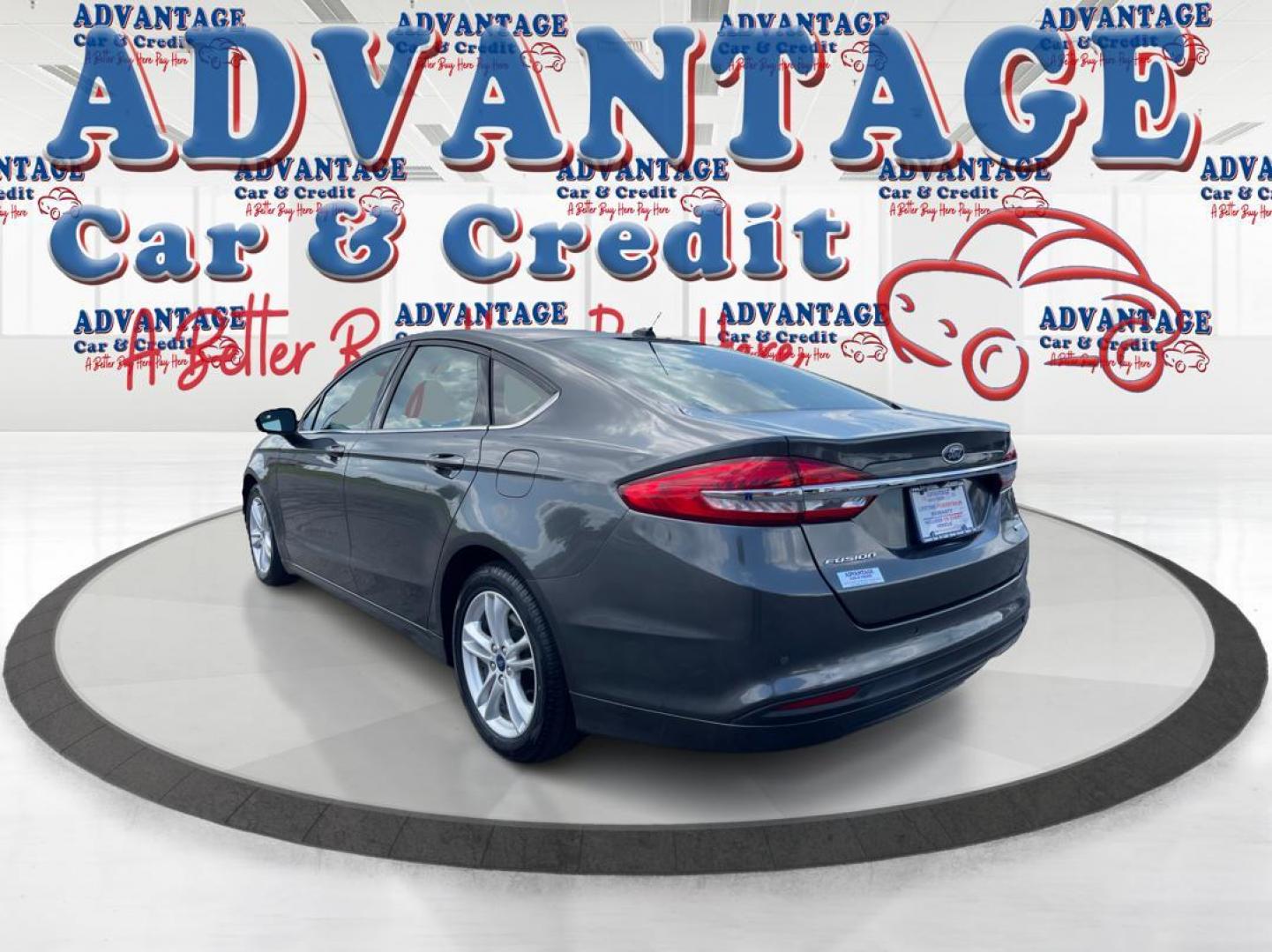 2018 Magnetic Metallic Ford Fusion SE (3FA6P0HD2JR) with an 1.5L L4 DOHC 16V engine, 6A transmission, located at 1184 Kauffman Ave, Fairborn, OH, 45324, (937) 908-9800, 39.807072, -84.030914 - Photo#4