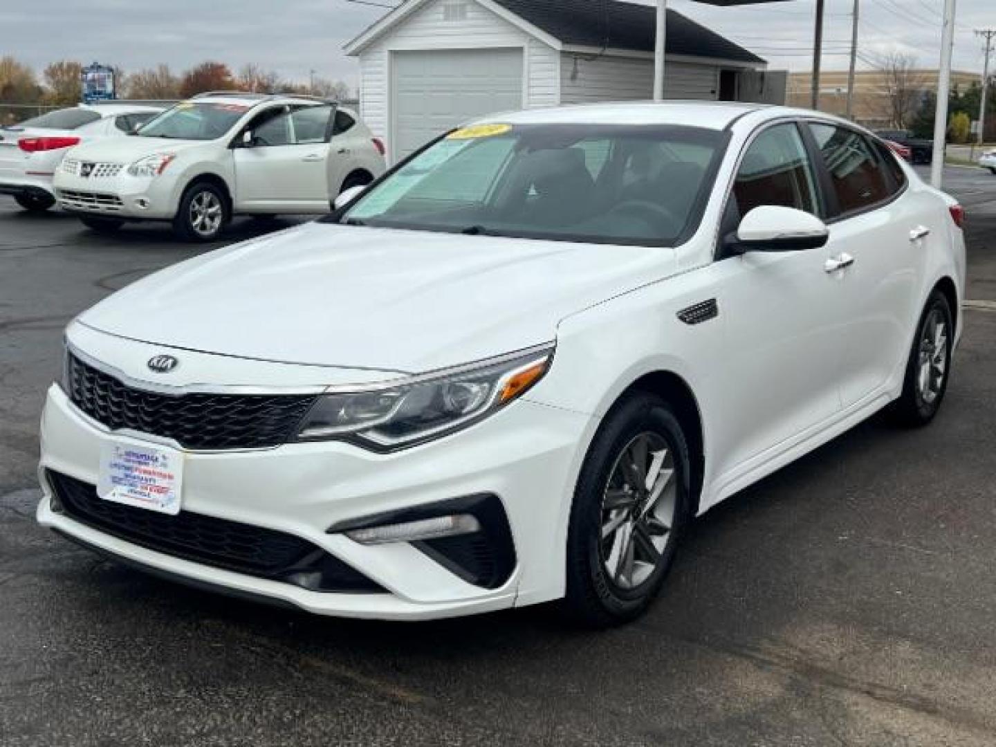 2019 Snow White Pearl Kia Optima LX (5XXGT4L30KG) with an 2.4L L4 DOHC 16V engine, 6-Speed Automatic transmission, located at 880 E. National Road, Vandalia, OH, 45377, (937) 908-9800, 39.891918, -84.183594 - Photo#2