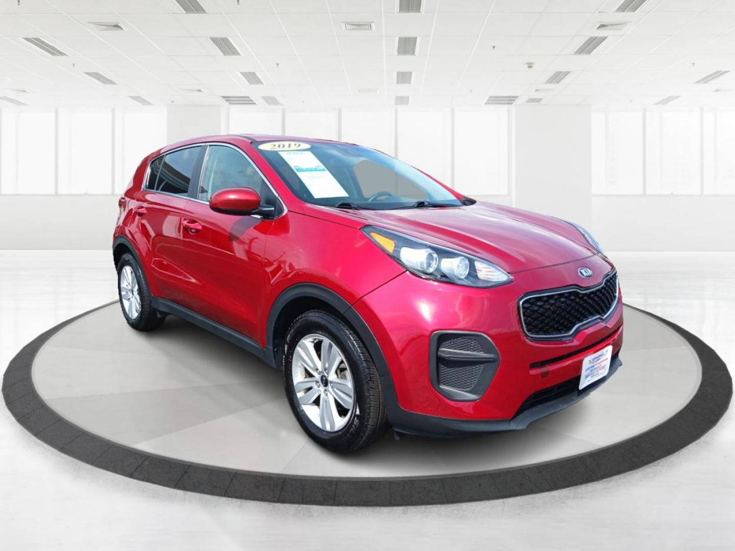 2019 Hyper Red Kia Sportage LX FWD (KNDPM3AC9K7) with an 2.4L V6 DOHC 24V engine, 6-Speed Automatic transmission, located at 1099 N County Rd 25A , Troy, OH, 45373, (937) 908-9800, 40.057079, -84.212883 - Photo#0