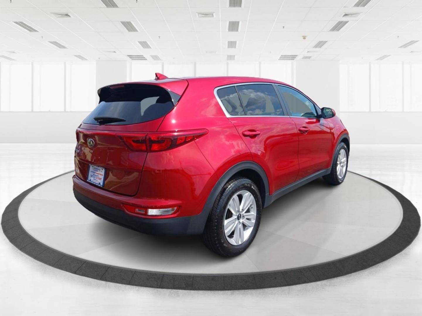 2019 Hyper Red Kia Sportage LX FWD (KNDPM3AC9K7) with an 2.4L V6 DOHC 24V engine, 6-Speed Automatic transmission, located at 1099 N County Rd 25A , Troy, OH, 45373, (937) 908-9800, 40.057079, -84.212883 - Photo#2